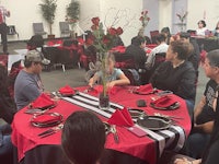 a group of people sitting at a table