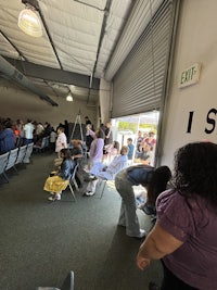 a group of people standing in a room