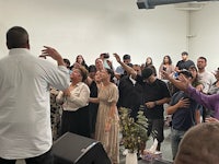 a group of people standing in a room