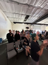 a group of people standing in a room