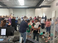 a group of people standing in a room