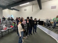 a group of people standing in a church