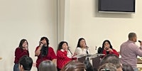 a group of people singing in front of a church