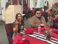 a man and a woman sitting at a table