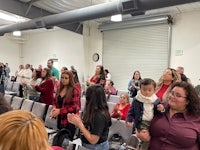 a group of people standing in a room