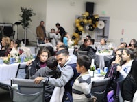a group of people sitting at tables in a room