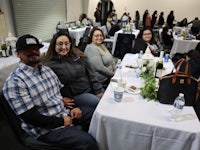 a group of people sitting at a table