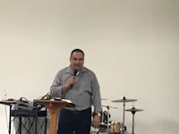 a man standing in front of a microphone