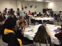 a group of people eating at a table