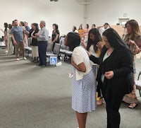 a group of people standing in a room