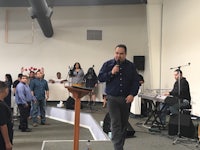 a man standing in front of a group of people