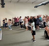 a group of people standing in a room