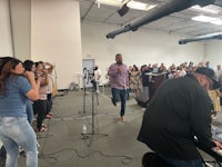a group of people standing in front of a microphone