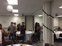 a group of people standing in a room