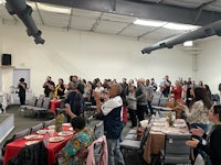 a large group of people gathered in a room