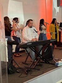 a group of people standing in front of a stage