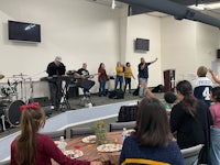 a group of people at a table in a church