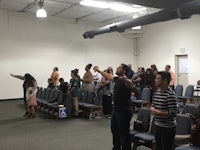 a group of people standing in a room