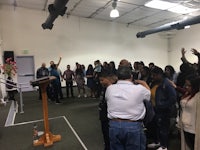 a group of people standing in a room