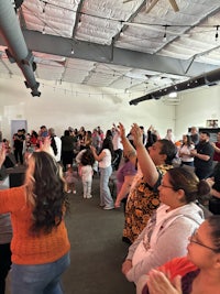 a group of people standing in a room
