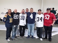 a group of men posing for a photo