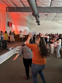 a group of people dancing in a room