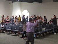 a group of people standing in a room