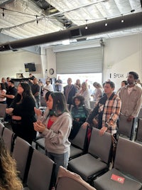 a group of people standing in a room