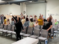 a group of people standing in a room