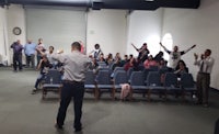 a group of people standing up in a room
