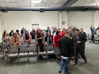 a group of people standing in a room