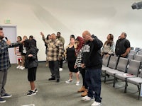 a group of people standing in a room