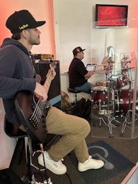 a man playing drums in a recording studio