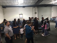 a group of people standing in a room