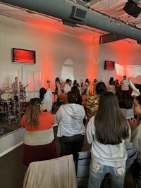 a group of people standing in a room
