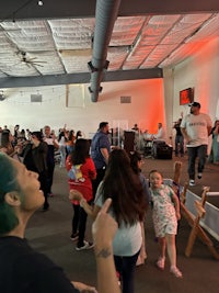 a group of people dancing in a room