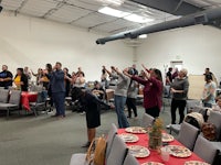 a group of people standing in a room