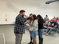 a man standing in front of a group of people