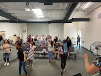 a group of people standing in a room