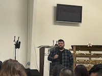 a man standing in front of a group of people